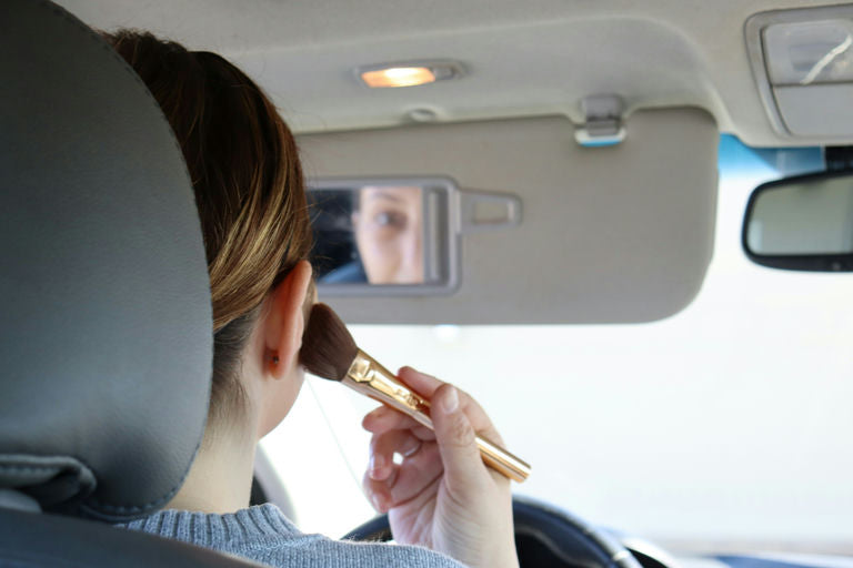 Woman using hair appliances for styling while following proper hair care steps